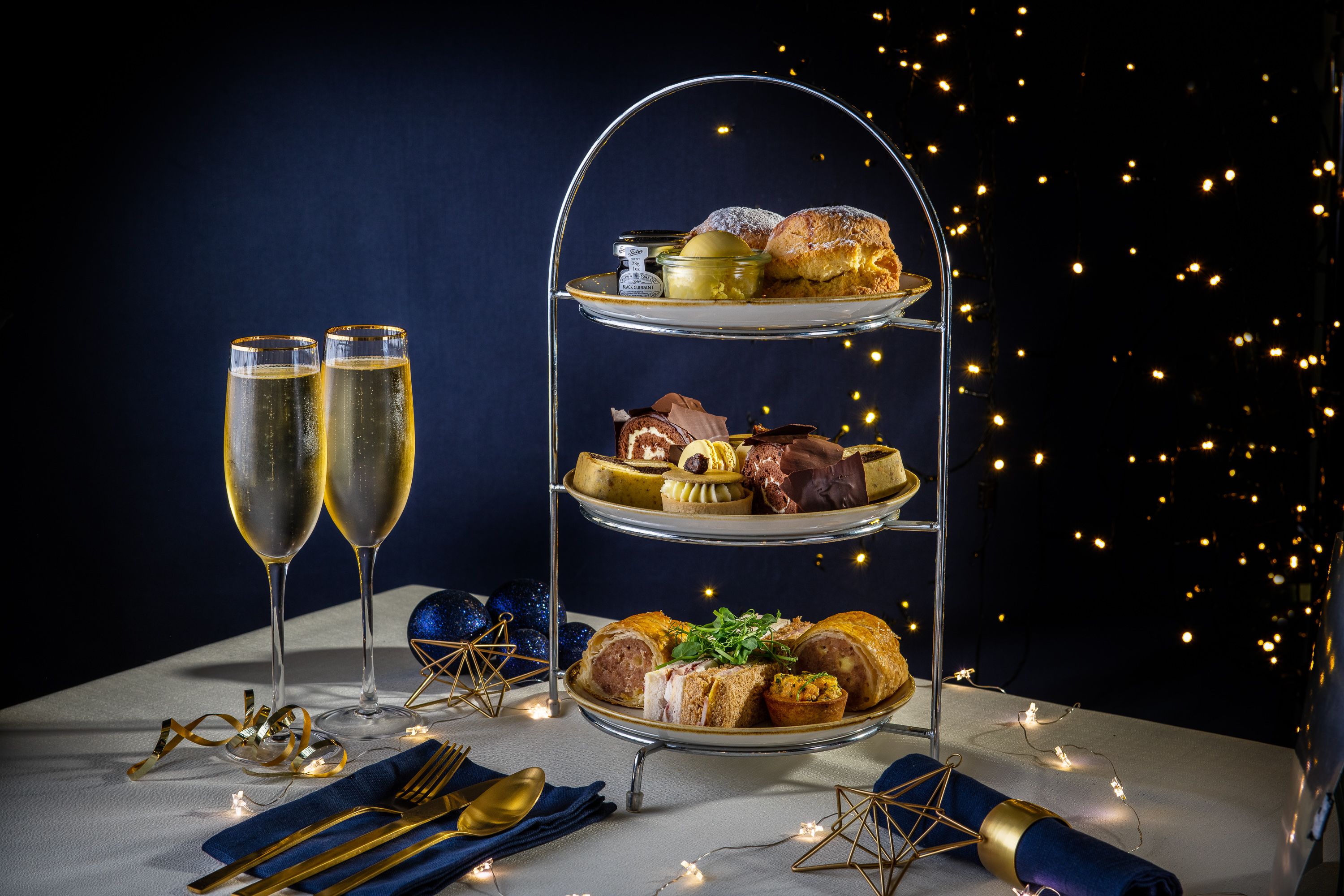 Three tiers of festive finger food and champagne