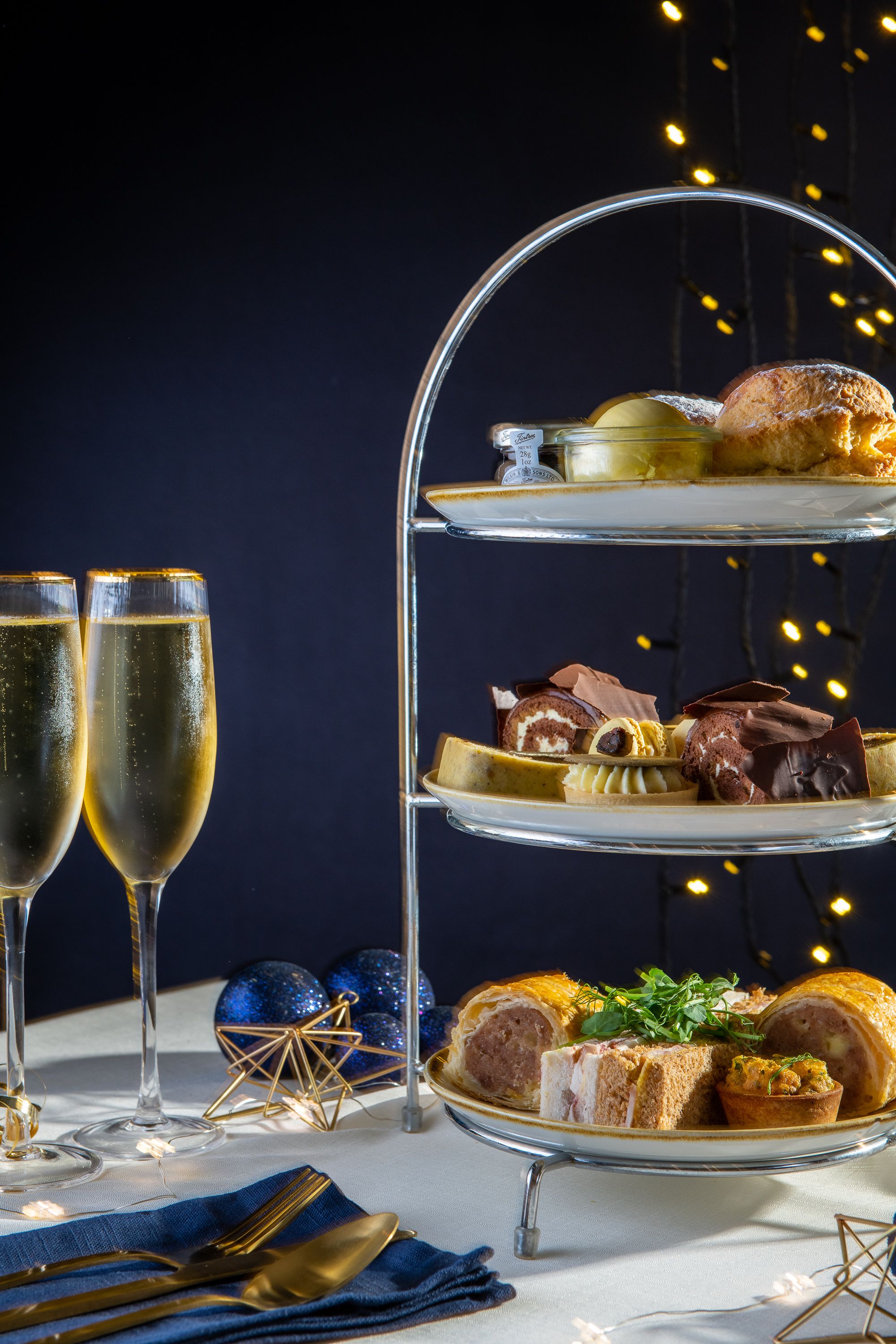 Three tiers of festive finger food and champagne